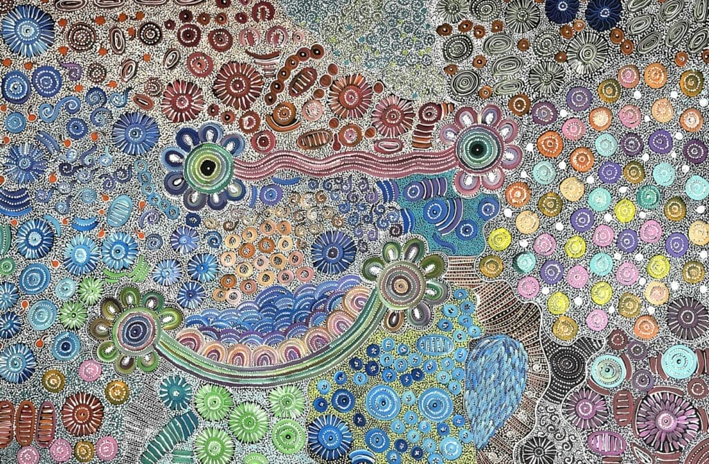 Aboriginal dot painting with circular patterns and floral motifs in various colours