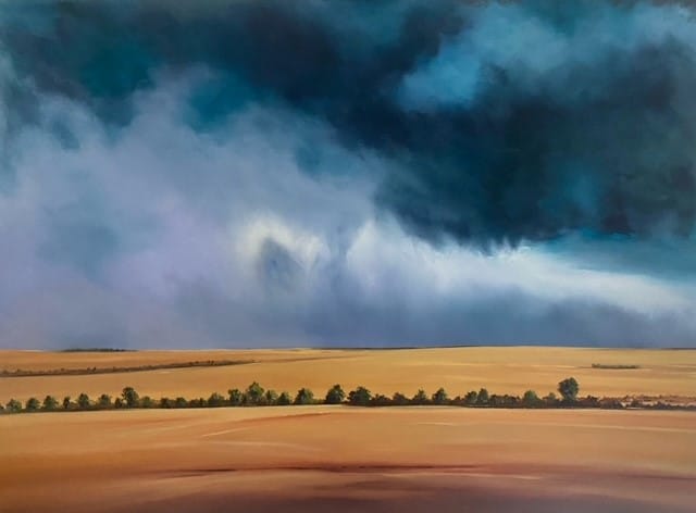 Landscape painting of a stormy sky over golden fields and a line of trees